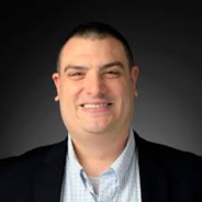 Jeffrey Olimpo in a black suit